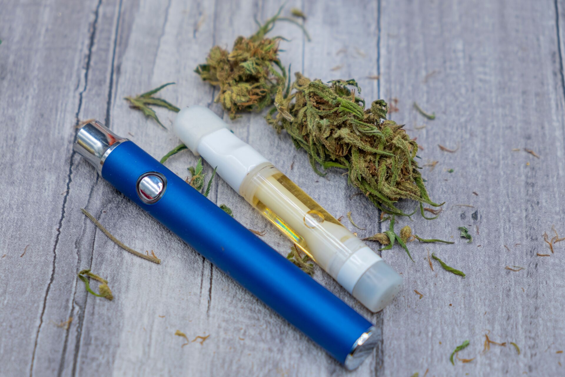 CDB. Cannabis oil extract In Vape pen cartridge and marijuana buds